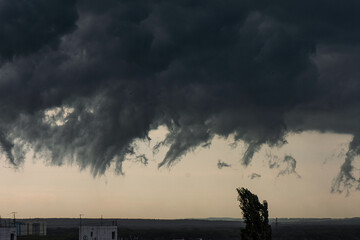 The stormy sky. Black ragged clouds over the city
