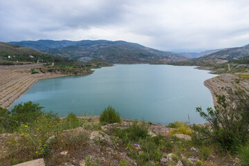 Fototapeta na wymiar Beninar reservoir surrounded by mountains