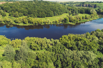 Landscape with a river on a sunny day. View from above. Beautiful nature of Norway. Europe