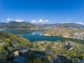 Beninar reservoir surrounded by mountains