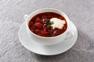 Traditional Ukrainian Russian borsch. Beetroot soup on gray background	