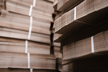 Products and corrugated cardboard. Factory for the manufacture and processing of paper. Copy space, stacks. Selective focus. Capacities and packaging. stock