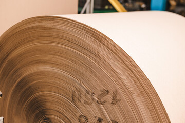 Big Stack of Printing Paper Rolls in Warehouse. The concept of production of paper and paperboard....