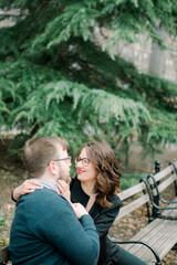 Fototapeta premium A couple in love having a romantic moment and showing mutual affection in a local urban park outdoors