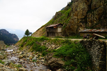 derelict building on a mountain road