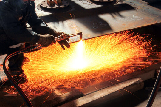 View of the oxygen, fuel  and flame cutting with welding torch.