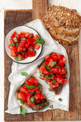 Bruschetta with tomatoes, herbs and olive oil.