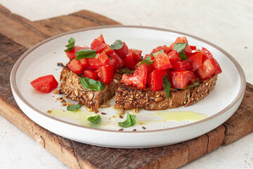 Bruschetta with tomatoes, herbs and olive oil.