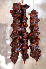 Turkish traditional snack dessert, walnut sucuk. It is made with grape molasses and walnuts. Close-up view.