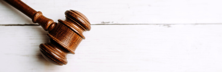 Gavel banner on a white wood background, law concept, judgment 