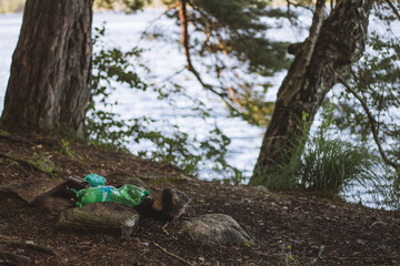 littering at campsite in the forest, plastic garbage left at campsite