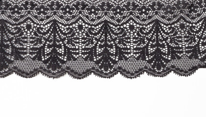 Black lace texture with flowers on a white background. Background of black lace with a flower pattern on a white background. Black guipure. Black fabric with an ornament.