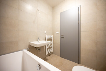 Bathroom and toilet in an apartment for rent. Real estate photo.