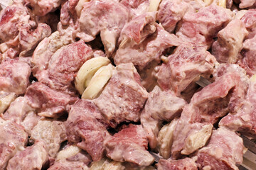 Pickled kebab. Fresh meat with onions. Food background