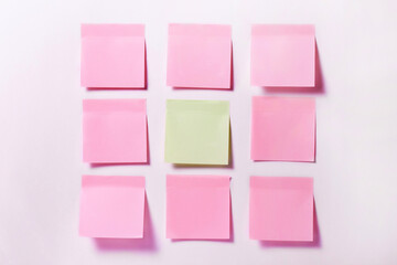 Nine office multi-colored stickers for notes pasted on the wall. The concept of the reminder,...