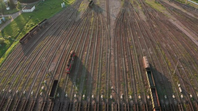 Assembly of trains at a large marshalling yard. Wagons roll along different tracks to assemble trains