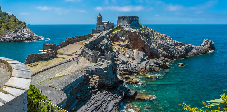 A panorama view of the promontory of the church of Saint Peter in Porto Venere, Italy in the summertime