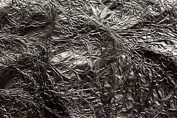 silver crumpled foil texture, abstract background - 363317428