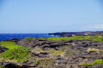 Panoramic view over lava fields and coast line in Volcanoes National Park on Big Island in Hawaii...