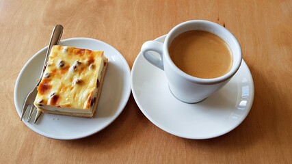 Traditional black coffee and curd cheese cake with raisins for morning breakfast