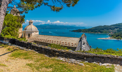 A view from Doria Castle towards the church of San Lorenzo in Porto Venere, Italy in the summertime