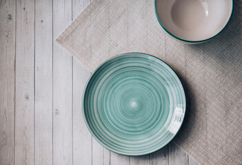 empty aquamarine plate on wooden table