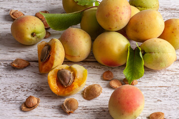 Apricot fruit. Fresh organic apricots on a white wooden background. Vega food.