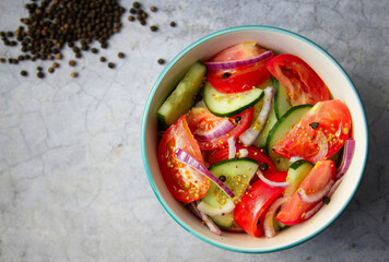 tomatoes and cucumbers salad with red onion