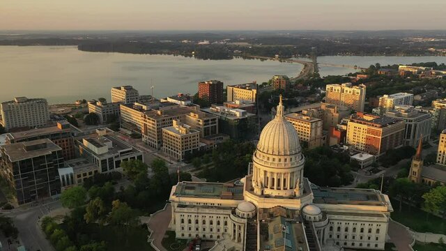 Aerial view of City of Madison. The capital city of Wisconsin from above. Drone flying over Wisconsin State Capitol in downtown. Sunny morning, sunrise (sunset), sunlight, summertime