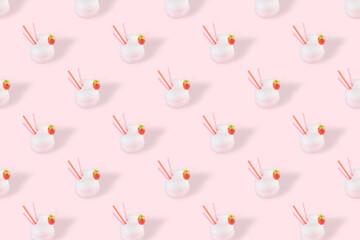 Pattern of strawberry milkshakes on a light background in transparent glass. Creative concept of delicious fresh drinks, healthy food for breakfast and snacks.