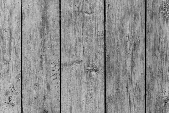 Rustic wood texture or background with scratched paint.  Monochrome.