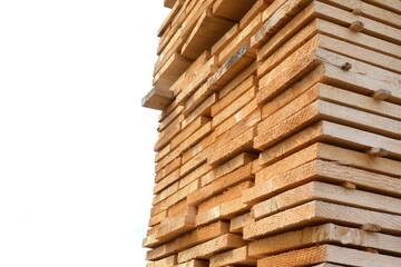 large stacks of wooden planks isolated on white background.