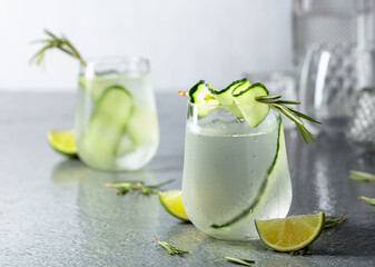 Detox drink or green iced refreshing lemonade with rosemary, cucumber and lime.