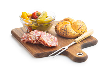 Sliced italian salami with hazelnuts, pickled chili peppers and pickles