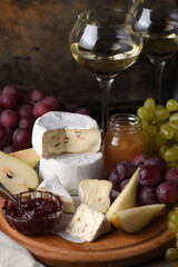 Antipasti. Cheese camembert with fruit and wine