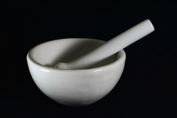 white mortar and pestles isolated on black background