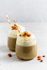 Halloween party drink, whipped cream coffee in glass. Selective focus, copy space.