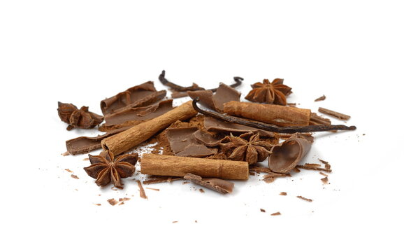 Cinnamon sticks,anise star, chocolate rolls and cocoa powder isolated on white background close up. Spice Cinnamon sticks and anise star.