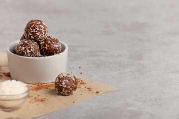 Raw food balls in a bowl with carob