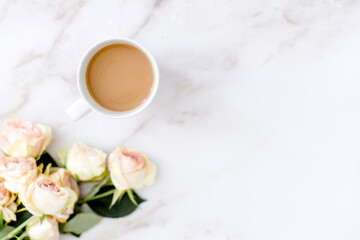 Coffee cup and. roses