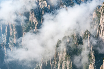 Clouds by the mountain peaks of Huangshan National park.