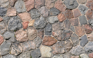 background old brick wall from the ruined castle, round blocks, red brick.