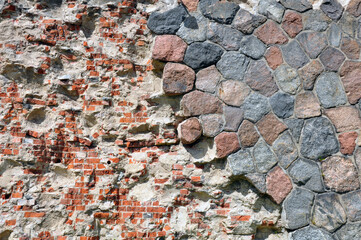 background old brick wall from the ruined castle, round blocks, red brick.