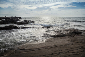 Rocky seashore under under the cloudy sky