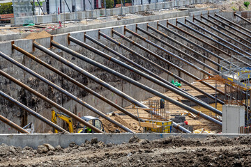 Steel beams supporting concrete wall