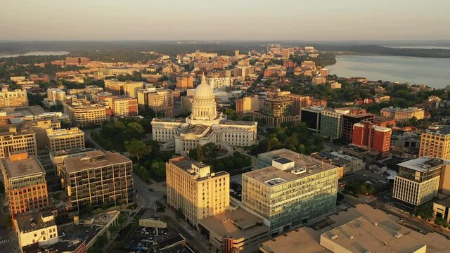 Aerial view of City of Madison. The capital city of Wisconsin from above. Drone flying over Wisconsin State Capitol in downtown. Sunny morning, sunrise (sunset), sunlight, summertime
