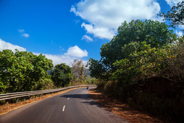 Fototapeta na wymiar Landscape with the road and mountains view in South Goa