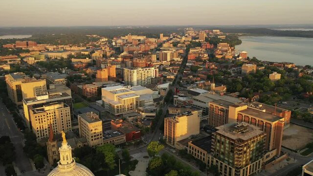 Aerial view of City of Madison. The capital city of Wisconsin from above. Drone flying over Wisconsin State Capitol in downtown. Sunny morning, sunrise (sunset), sunlight, summertime