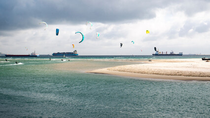 Skysurfing in the Gibraltar bay/Algeciras on the beach and many cargo ships on back ground