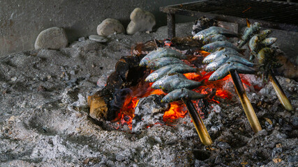 Sardine spits in Almuñecar, Costa Tropical. Esparto is the typical way of making sardines on the Andalusian coast